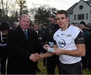 29 November 2014; Drew Wylie, Monaghan, 2013 All Stars, is presented with a medal after the game by Uachtarán Chumann Lúthchleas Gael Liam Ó Néill. GAA GPA All Star Tour 2014, sponsored by Opel, 2013 All Stars v 2014 All Stars. Irish Cultural Centre, New Boston Dr, Canton, Massachusetts, USA. Picture credit: Ray McManus / SPORTSFILE