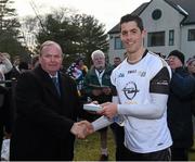 29 November 2014; Rory O'Carroll, Dublin, 2013 All Stars, is presented with a medal after the game by Uachtarán Chumann Lúthchleas Gael Liam Ó Néill. GAA GPA All Star Tour 2014, sponsored by Opel, 2013 All Stars v 2014 All Stars. Irish Cultural Centre, New Boston Dr, Canton, Massachusetts, USA. Picture credit: Ray McManus / SPORTSFILE
