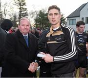 29 November 2014; Killian Clarke, Cavan, 2014 All Stars, is presented with a medal after the game by Uachtarán Chumann Lúthchleas Gael Liam Ó Néill. GAA GPA All Star Tour 2014, sponsored by Opel, 2013 All Stars v 2014 All Stars. Irish Cultural Centre, New Boston Dr, Canton, Massachusetts, USA. Picture credit: Ray McManus / SPORTSFILE