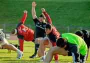 2 December 2014; Munster players, including Ian Keatley, right, and Duncan Casey, warm up during squad training ahead of their European Rugby Champions Cup 2014/15, Pool 1, Round 3, game against ASM Clermont Auvergne on Saturday. Munster Rugby Squad Training, University of Limerick, Limerick. Picture credit: Diarmuid Greene / SPORTSFILE
