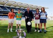 11 July 2005; An Taoiseach, Bertie Ahern TD, shows his football skills with players left to right, Aileen Mathews, Armagh, Elaine Duffy, Kerry, Aoibhean Daly, Galway, and Niamh McEvoy, Dublin, at the launch of the 2005 TG4 All-Ireland Ladies Football Championship. Croke Park, Dublin. Picture credit; David Maher / SPORTSFILE