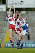 28 July 2007; Fergal Doherty and Enda Muldoon, Derry, in action against Paul Clancy, Laois. Bank of Ireland All-Ireland Senior Football Championship Qualifier, Round 3, Laois v Derry, Kingspan Breffni Park, Cavan. Picture credit: Ray Lohan / SPORTSFILE
