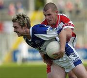 28 July 2007; Michael Tierney, Laois, in action against Francis McEldowney, Derry. Bank of Ireland All-Ireland Senior Football Championship Qualifier, Round 3, Laois v Derry, Kingspan Breffni Park, Cavan. Picture credit: Ray Lohan / SPORTSFILE