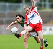28 July 2007; Cathy Donnelly, Tyrone, in action against Aoife Watters, Donegal. TG4 Ladies All-Ireland Senior Football Championship, Group 3, Tyrone v Donegal. Healy Park, Omagh, Co. Tyrone. Picture credit; Oliver McVeigh / SPORTSFILE