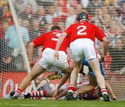 29 July 2007; Cork goalkeeper Donal Og Cusack attempts to gather the sliothar with help from team-mates Diarmuid O'Sullivan, 3 and Shane O'Neill, 2, as Waterford's Paul Flynn, hidden, challenges, during the final seconds of the game. Guinness All-Ireland Senior Hurling Championship Quarter-Final, Cork v Waterford, Croke Park, Dublin. Picture credit; Brendan Moran / SPORTSFILE
