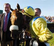 30 July 2007; Jockey Matthew O'Connor kisses his mount Loyal Focus after victory in The GPT Galway Handicap Hurdle while  trainer Dermot Weld, left, looks on. Galway Racecourse, Ballybrit, Co. Galway. Picture credit; Pat Murphy / SPORTSFILE