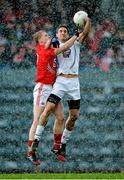 9 February 2014; Gary White, Kildare, in action against Ruairi Deane, Cork. Allianz Football League, Division 1, Round 2, Cork v Kildare, Páirc Uí RInn, Cork. Picture credit: Matt Browne / SPORTSFILE