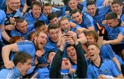 3 May 2014; Dublin players gather for a 'selfie' as they celebrate with the cup. Cadbury GAA Football All-Ireland U21 Championship Final, Dublin v Roscommon, O'Connor Park, Tullamore, Co. Offaly. Picture credit: Ray McManus / SPORTSFILE