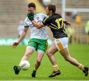 22 June 2014; Martin McElhinney, Donegal, is tackled by Tony Scullion, Antrim. Ulster GAA Football Senior Championship, Semi-Final, Donegal v Antrim, St Tiernach's Park, Clones, Co. Monaghan. Picture credit: Oliver McVeigh / SPORTSFILE