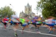 27 October 2014; Participants make their way down High Street past Christ Church Cathedral during the SSE Airtricity Dublin Marathon 2014. Christ Church, Dublin. Picture credit: Cody Glenn / SPORTSFILE