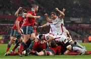 28 November 2014; Ulster players celebrate after Nick Williams, hidden, goes over for a late try. Guinness PRO12, Round 9, Munster v Ulster, Thomond Park, Limerick. Picture credit: Stephen McCarthy / SPORTSFILE