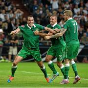 14 October 2014; Republic of Ireland's John O'Shea, left, celebrates after scoring his side's equalizing goal with team-mates Jonathan Walters, centre, and James McClean. UEFA EURO 2016 Championship Qualifer, Group D, Germany v Republic of Ireland, Veltins Stadium, Gelsenkirchen, Germany. Picture credit: David Maher / SPORTSFILE
