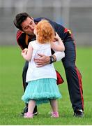 13 July 2014; Carlow manager Anthony Rainbow gets a kiss from his daughter Robin, aged three years, after the game. GAA Football All-Ireland Senior Championship Round 2B, Carlow v Clare, Dr Cullen Park, Carlow. Picture credit: Dáire Brennan / SPORTSFILE