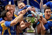 7 June 2014; Longford's Conor Egan celebrates with his 8 month old daughter Elayna and the Lory Meagher Cup. Lory Meagher Cup Final, Longford v Fermanagh, Croke Park, Dublin. Picture credit: Piaras Ó Mídheach / SPORTSFILE