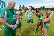 9 August 2014; Coach Brian Corcoran, left, breaks the news to the mixed Under 16 4X100 relay team, from left, Luke Morris, Daniel Ryan, Gina Akpe-Moses and Molly Scott that they have set a new national record of 45.42. 2014 Celtic Games, Morton Stadium, Santry, Co. Dublin. Picture credit: Cody Glenn / SPORTSFILE