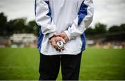 15 June 2014; An umpire holds a sliotar during the game. Ulster GAA Hurling Senior Championship, Down v Donegal, St Tiernach's Park, Clones, Co. Monaghan. Picture credit: Brendan Moran / SPORTSFILE