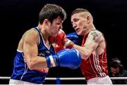 5 December 2014; Barry Walsh, right, exchanges punches with Dylan Tang during their 57kg bout. National Intermediate Boxing Championships, National Stadium, Dublin. Picture credit: Ramsey Cardy / SPORTSFILE
