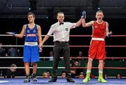5 December 2014; Barry Walsh, right, is declared the winner over Dylan Tang after their 57kg bout. National Intermediate Boxing Championships, National Stadium, Dublin. Picture credit: Ramsey Cardy / SPORTSFILE