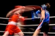5 December 2014; Louise Donohoe, Geesala, left, exchanges punches with Ciara Dowling, Carrickmacross, during their 60kg bout. National Intermediate Boxing Championships, National Stadium, Dublin. Picture credit: Ramsey Cardy / SPORTSFILE