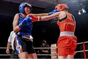 5 December 2014; Louise Donohoe, Geesala, right, exchanges punches with Ciara Dowling, Carrickmacross, during their 60kg bout. National Intermediate Boxing Championships, National Stadium, Dublin. Picture credit: Ramsey Cardy / SPORTSFILE