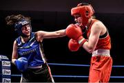 5 December 2014; Louise Donohoe of Geesala, right, exchanges punches with Ciara Dowling of Carrickmacross during their 60kg bout in the National Intermediate Boxing Championships at the National Stadium in Dublin. Photo by Ramsey Cardy/Sportsfile