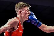 5 December 2014; Gary Cully, St Davids, Naas, is caught by a right jab from Hughie Joyce, St Michaels, Athy, during their 60kg bout. National Intermediate Boxing Championships, National Stadium, Dublin. Picture credit: Ramsey Cardy / SPORTSFILE