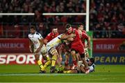 6 December 2014; Pat Howard, Munster, is tackled by Jamie Cudmore, ASM Clermont Auvergne. European Rugby Champions Cup 2014/15, Pool 1, Round 3, Munster v ASM Clermont Auvergne, Thomond Park, Limerick. Picture credit: Diarmuid Greene / SPORTSFILE