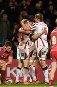 6 December 2014; Darren Cave, Ulster, celebrates with Dan Tuohy and Franco van der Merwe after scoring his side's opening try. European Rugby Champions Cup 2014/15, Pool 3, Round 3, Ulster v Scarlets, Kingspan Stadium, Ravenhill Park, Belfast, Co. Antrim. Picture credit: Oliver McVeigh / SPORTSFILE