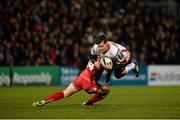6 December 2014; Louis Ludik, Ulster, is tackled by Harry Robinson, Scarlets. European Rugby Champions Cup 2014/15, Pool 3, Round 3, Ulster v Scarlets, Kingspan Stadium, Ravenhill Park, Belfast, Co. Antrim. Picture credit: Oliver McVeigh / SPORTSFILE