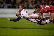 6 December 2014; Ruan Pienaar, Ulster, scores his side's second try despite the tackle of Rhys Priestland, Scarlets. European Rugby Champions Cup 2014/15, Pool 3, Round 3, Ulster v Scarlets, Kingspan Stadium, Ravenhill Park, Belfast, Co. Antrim. Picture credit: Oliver McVeigh / SPORTSFILE