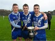 6 December 2014; St Mary's players Denis Daly, Paul O'Donoghue and Daniel Daly with the Jack Murphy Cup following their South Kerry Championship Final victory. South Kerry Championship Final Replay, St Mary's v Waterville. Con Keating Park, Cahersiveen, Co. Kerry. Picture credit: Stephen McCarthy / SPORTSFILE
