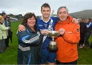 6 December 2014; St Mary's Paul O'Donoghue with Noreen and Paul O'Donoghue following their South Kerry Championship Final victory. South Kerry Championship Final Replay, St Mary's v Waterville. Con Keating Park, Cahersiveen, Co. Kerry. Picture credit: Stephen McCarthy / SPORTSFILE