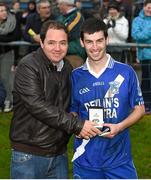 6 December 2014; St Mary's Sean Cournane is presented with the Man of the Match award by Patrick Fogarty following their South Kerry Championship Final victory. South Kerry Championship Final Replay, St Mary's v Waterville. Con Keating Park, Cahersiveen, Co. Kerry. Picture credit: Stephen McCarthy / SPORTSFILE
