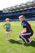 31 July 2007; Croke Park became a theatre of dreams today as over 250 young Camogie stars of the future enjoyed a first experience of playing on the hallowed turf. U-14 players on the Coillte Development Squads from Clare, Derry, Kerry, Laois, Louth, Monaghan, Tipperary and Westmeath were granted the rare opportunity to hone their skills at headquarters as part of the Camogie Association’s national programme to develop the sport at juvenile level. The partnership with Coillte, supported by the Irish Sports Council, enables top level coaching and encouragement for young girls throughout the eight designated counties. At the tournament is Cork camogie star Mary O'Connor, Director of Camogie Development, with Caoimhe Spillane, age 5, from Abbeydorney, Kerry. 2007 Coillte U14 Camogie Development Squads tournament, Croke Park, Dublin. Picture credit: Brian Lawless / SPORTSFILE