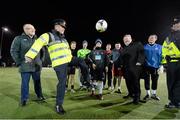 5 December 2014; An Garda Síochána Assistant Commissioner John Twomey tests out his skills while being watched on by Fran Gavin, left, FAI, and Dr. James Reilly, Minister for Children and Youth Affairs . Late Night Leagues Dublin Metropolitan Region Finals, Irishtown Stadium, Ringsend, Dublin. Photo by Sportsfile