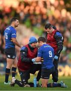 7 December 2014; Eoin Reddan, Leinster, is examined by head physiotherapist Garreth Farrell. European Rugby Champions Cup 2014/15, Pool 2, Round 3, Harlequins v Leinster. Twickenham Stoop, Twickenham, London, England. Picture credit: Stephen McCarthy / SPORTSFILE