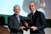 8 December 2014; Trainer Willie Mullins receiving the National Hunt award from Simon Coveney, TD, Minister for Agriculture, Food and the Marine. Horse Racing Ireland Awards. Leopardstown Racecourse, Leopardstown, Co. Dublin. Picture credit: Barry Cregg / SPORTSFILE