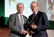 8 December 2014; Trainer Eddie Lynam receiving the Flat Racing award from Simon Coveney, TD, Minister for Agriculture, Food and the Marine. Horse Racing Ireland Awards. Leopardstown Racecourse, Leopardstown, Co. Dublin. Picture credit: Barry Cregg / SPORTSFILE