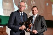 8 December 2014; Jockey Jamie Codd receiving the Point-To-Point award from Simon Coveney, TD, Minister for Agriculture, Food and the Marine. Horse Racing Ireland Awards. Leopardstown Racecourse, Leopardstown, Co. Dublin. Picture credit: Barry Cregg / SPORTSFILE