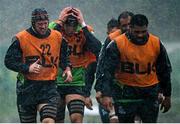9 December 2014; Connacht players, from left to right, Eoin McKeon, Ultan Dillane, George Naoupu, and Rodney Ah You during heavy rainfall at squad training ahead of their European Rugby Challenge Cup match against Bayonne on Saturday. Connacht Rugby Squad Training, The Sportsground, Galway. Picture credit: Diarmuid Greene / SPORTSFILE