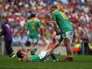 4 August 2007; Graham Geraghty, Meath, assists his colleague Chris O'Connor with cramp towards the end of the game. Bank of Ireland Football Championship Quarter Final, Tyrone v Meath, Croke Park, Dublin. Picture Credit; Stephen McCarthy / SPORTSFILE
