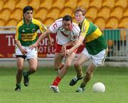 5 August 2007; Kyle Coney, Tyrone, in action against Wayne Gutherie and JB Spillane, Kerry. ESB All-Ireland Minor Football Championship Quater-Final, Tyrone v Kerry, O'Connor Park, Tullamore, Co. Offaly. Picture credit; Oliver McVeigh / SPORTSFILE