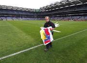 5 August 2007; Groundsman Paddy Walsh collects the sideline flags after the game. Guinness All-Ireland Hurling Championship Quater-Final Replay, Cork v Waterford, Croke Park, Dublin. Picture credit; Ray McManus / SPORTSFILE