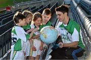 12 December 2014; Dublin hurler Danny Sutcliffe with eight year old stars of the future Jason Gallagher, Aoife Penrose, Aishling Trainor and Aaron Dalton, from Holy Trinity Senior National School, Donaghmede, at the launch of the GAA World Games sponsored by Etihad Airways. Croke Park, Dublin. Picture credit: Ray McManus / SPORTSFILE