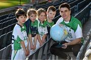 12 December 2014; Dublin hurler Danny Sutcliffe with eight year old stars of the future Jason Gallagher, Aoife Penrose, Aishling Trainor and Aaron Dalton, from Holy Trinity Senior National School, Donaghmede, at the launch of the GAA World Games sponsored by Etihad Airways. Croke Park, Dublin. Picture credit: Ray McManus / SPORTSFILE