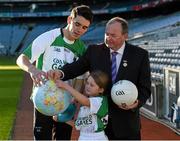 12 December 2014; Dublin hurler Danny Sutcliffe with eight year old star of the future Aoife Penrose from Holy Trinity Senior National School, Donaghmede, and Uachtarán Chumann Lúthchleas Gael Liam Ó Néill at the launch of the GAA World Games sponsored by Etihad Airways. Croke Park, Dublin. Picture credit: Ray McManus / SPORTSFILE