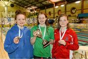 12 December 2014; Medallists in the Women's 100m Breaststroke, from left, Niamh Kilgallen, silver, Claremorris swimming club, Dearbhail McNamara, gold, Castlebar swimming club, and Mona McSharry, bronze, Marlins swimming club, Ballyshannon, at the Irish Short Course Swimming Championships Day 1. Lagan Valley LeisurePlex, Lisburn, Co. Antrim. Picture credit: Oliver McVeigh / SPORTSFILE