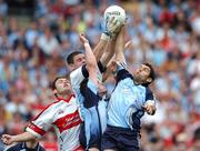 11 August 2007; Dublin goalkeeper Stephen Cluxton gets to the ball ahead of team-mates Ross McConnell and David Henry and Derry's Eoin Bradley. Bank of Ireland All-Ireland Senior Football Championship Quarter-Final, Dublin v Derry, Croke Park, Dublin. Picture credit; Brendan Moran / SPORTSFILE