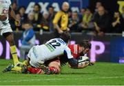 14 December 2014; Duncan Casey, Munster, scores a late try against ASM Clermont Auvergne despite the tackle of Brock James. European Rugby Champions Cup 2014/15, Pool 1, Round 4, ASM Clermont Auvergne v Munster, Stade Marcel-Michelin, Clermont, France. Picture credit: Matt Browne / SPORTSFILE