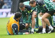 11 August 2007; Shane Horgan, Ireland, lies on the ground after injuring himself and is attended to by Cameron Steele, centre, team Physiotherapist, and Fitness coach Mike McGurn. Rugby World Cup Warm Up Game, Scotland v Ireland, Murrayfield, Scotland. Picture credit; Oliver McVeigh / SPORTSFILE